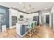 Bright kitchen with stainless appliances, granite countertops, and seating at the island at 17335 W 94Th Ave, Arvada, CO 80007