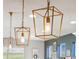Modern kitchen lighting with unique open-caged pendant lights over the island at 17335 W 94Th Ave, Arvada, CO 80007