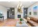 Inviting living room featuring a fireplace, built-in shelves, and comfortable leather sofa at 17335 W 94Th Ave, Arvada, CO 80007