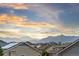 Scenic neighborhood with mountain views at sunset and solar panels on roofs at 17335 W 94Th Ave, Arvada, CO 80007