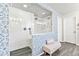 Sleek walk-in shower with dual showerheads, surrounded by attractive patterned tilework, creates a spa-like experience at 17335 W 94Th Ave, Arvada, CO 80007
