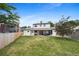 Spacious backyard with covered patio, seating, and lawn at 10378 W Weaver Ave, Littleton, CO 80127
