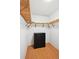 Organized walk-in closet with wooden shelving and hardwood floors at 10378 W Weaver Ave, Littleton, CO 80127