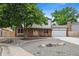 Attractive two-story home with a manicured front yard, mature tree, and an attached two-car garage at 10378 W Weaver Ave, Littleton, CO 80127