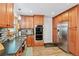 Bright kitchen featuring stainless steel appliances, granite countertops, and plenty of storage space at 10378 W Weaver Ave, Littleton, CO 80127