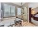 Elegant bathroom featuring a soaking tub and glass shower at 9680 Burberry Way, Highlands Ranch, CO 80129