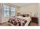 Comfortable bedroom featuring plush carpeting and abundant natural light at 9680 Burberry Way, Highlands Ranch, CO 80129