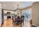 Eat-in kitchen featuring stainless steel appliances, hardwood floors and sliding glass doors at 9680 Burberry Way, Highlands Ranch, CO 80129