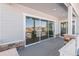 Covered back patio with sliding glass doors and wood decking at 27750 E Lakeview Dr, Aurora, CO 80016