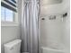 Simple bathroom with shower/tub combo and gray curtain at 27750 E Lakeview Dr, Aurora, CO 80016