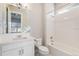 Bathroom with white vanity, toilet, and tub at 27750 E Lakeview Dr, Aurora, CO 80016