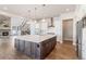 Modern kitchen with white cabinets, quartz countertops, and large island at 27750 E Lakeview Dr, Aurora, CO 80016