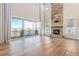 Bright living room with large windows and stone fireplace at 27750 E Lakeview Dr, Aurora, CO 80016