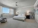 Spacious main bedroom with large window, plush bed, and neutral decor at 27750 E Lakeview Dr, Aurora, CO 80016