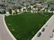 Aerial view of a neighborhood park and surrounding homes in a residential area at 942 Wagon Bend Rd, Berthoud, CO 80513