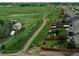 Aerial view of property with large green space nearby and backyard fencing at 942 Wagon Bend Rd, Berthoud, CO 80513