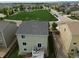 Aerial view of a house with a backyard deck and neighborhood at 942 Wagon Bend Rd, Berthoud, CO 80513