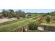 View of a grass backyard area with wood fence, landscaping, and distant field at 942 Wagon Bend Rd, Berthoud, CO 80513