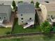 Aerial shot of the backyard and deck with a manicured lawn and privacy fence at 942 Wagon Bend Rd, Berthoud, CO 80513