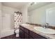 Bright bathroom featuring a double sink vanity with laminate countertops and a shower-tub combination at 942 Wagon Bend Rd, Berthoud, CO 80513