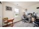 Cozy bedroom with vintage desk and modern computer setup near a bright window at 942 Wagon Bend Rd, Berthoud, CO 80513