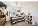 Comfortable bedroom with a ceiling fan, window with blinds, and a collection of toys at 942 Wagon Bend Rd, Berthoud, CO 80513