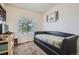 Neat bedroom featuring a trundle bed by a window and built-in desk with storage at 942 Wagon Bend Rd, Berthoud, CO 80513