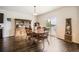 Elegant dining room with hardwood floors, stylish furniture, and access to the deck at 942 Wagon Bend Rd, Berthoud, CO 80513