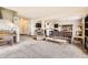 Bright living room featuring neutral carpet and ample space for entertaining guests at 942 Wagon Bend Rd, Berthoud, CO 80513