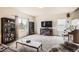 Cozy living room with plush carpet, fireplace, and large windows for natural light at 942 Wagon Bend Rd, Berthoud, CO 80513