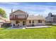 Spacious backyard with a lawn, patio, and back deck at 12089 W Burgundy Ave, Littleton, CO 80127