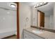 Well-maintained bathroom features a shower-tub combination and a sink with ample counter space at 12089 W Burgundy Ave, Littleton, CO 80127