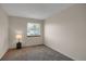Comfortable bedroom with soft carpeting and a bright window overlooking the neighborhood at 12089 W Burgundy Ave, Littleton, CO 80127