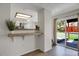 Bright room with hardwood floors, eat in bar, and sliding glass doors to the backyard at 12089 W Burgundy Ave, Littleton, CO 80127