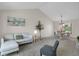 Open-concept living room and dining area with neutral tones and a decorative tree at 12089 W Burgundy Ave, Littleton, CO 80127