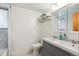 Bright bathroom featuring a double vanity, mirrored cabinet, and hexagon tile flooring at 5856 Simms St, Arvada, CO 80004