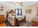 Comfortable bedroom with natural light, decorative rug, and traditional furnishings at 5856 Simms St, Arvada, CO 80004