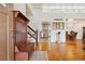 Inviting foyer features hardwood floors, coat rack, and staircase to the second floor at 5856 Simms St, Arvada, CO 80004