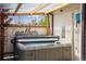 Inviting hot tub area with a pergola, offering a relaxing and private outdoor experience at 5856 Simms St, Arvada, CO 80004