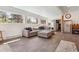 Bright living room with large windows, comfortable seating, and wood floors at 5856 Simms St, Arvada, CO 80004
