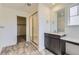 Bathroom featuring a glass-enclosed shower, single vanity, and walk-in closet at 24715 E Evans Dr, Aurora, CO 80018