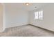 Bedroom with neutral carpet, white walls, and a large window for natural light at 24715 E Evans Dr, Aurora, CO 80018