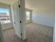 Neutral bedroom offers great natural light and plush carpeting, ideal for comfort and style at 25343 E Warren Pl, Aurora, CO 80018