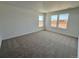 Spacious carpeted bedroom with multiple windows offering plenty of natural light at 25343 E Warren Pl, Aurora, CO 80018