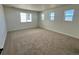 Large carpeted bedroom features three windows providing lots of natural light at 25343 E Warren Pl, Aurora, CO 80018