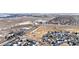 Aerial view of a neighborhood with a park, playground, and houses near a main road at 793 S 22Nd Ave, Brighton, CO 80601