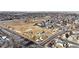 Aerial view of a residential area showcasing a park, playground, and surrounding houses at 793 S 22Nd Ave, Brighton, CO 80601