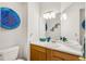 Clean bathroom with light wood vanity and a modern sink at 793 S 22Nd Ave, Brighton, CO 80601