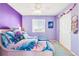 Bedroom with purple walls and double door closet at 793 S 22Nd Ave, Brighton, CO 80601