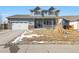 Two-story house with attached garage and landscaped yard at 793 S 22Nd Ave, Brighton, CO 80601